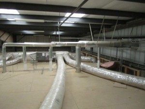 Dust collection system ductwork above the ceiling of the testing room