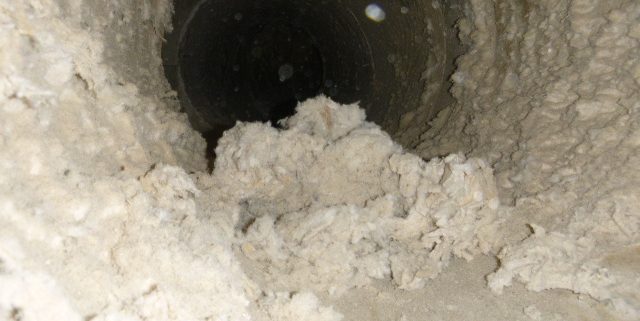 Dust build up inside a duct connected to a dust collector