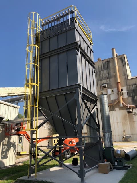 Baghouse.com provided and installed a new baghouse system equipped with a fan and optimized ductwork.