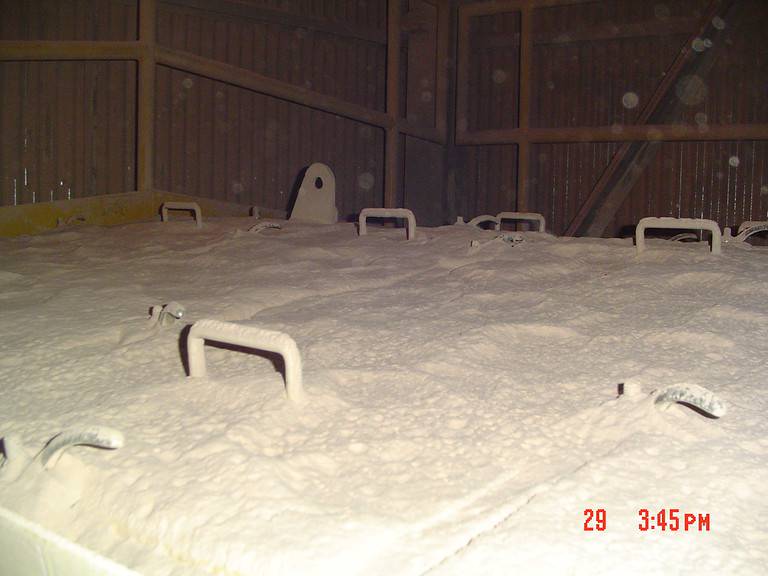 Gypsum dust accumulation on top of dust collector.